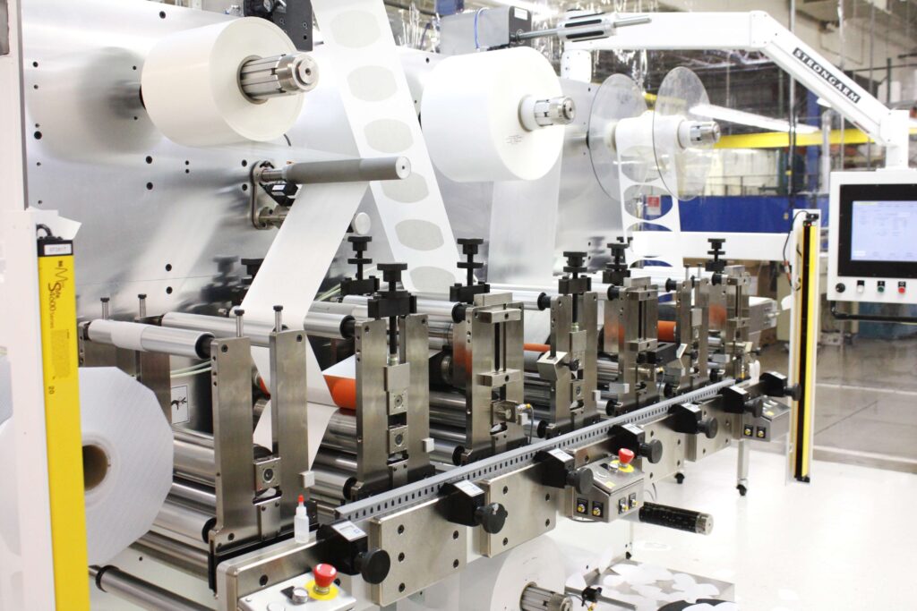 Rotary die cutting machinery within ISO Class 8 clean room manufacturing space